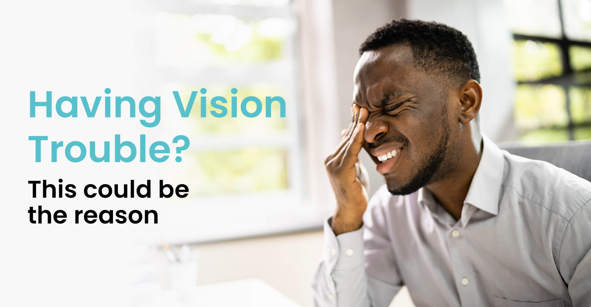 Man with eye pain rubbing his eyes